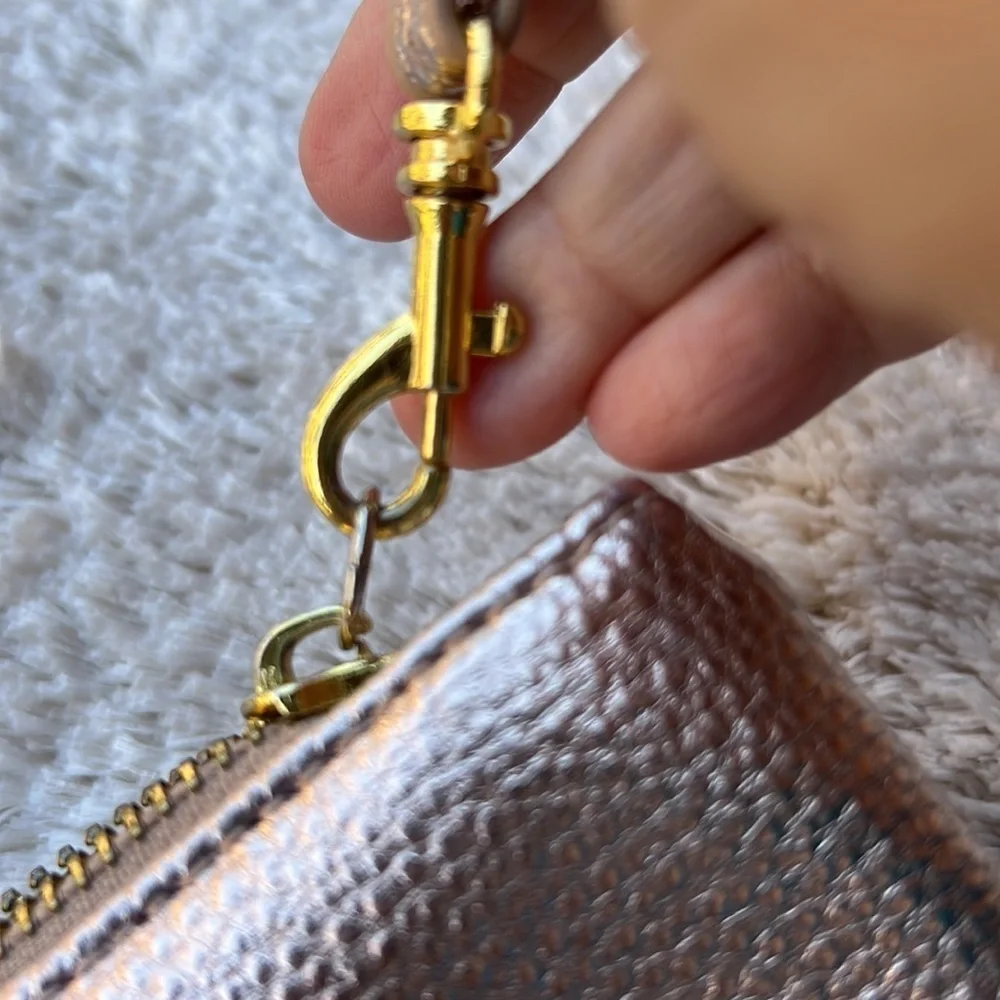 Francesca’s Rose Gold Clutch Wristlet